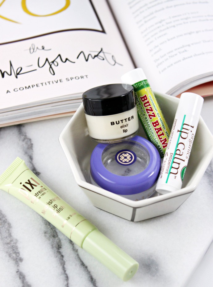 5 Best Lip Balms for Chapped Lips | Beessential Buzz Balm, PIXI Nourishing Lip Polish, BUTTER elixir lip balm, John Masters Organics Lip Calm, TATCHA Camellia Nourishing Lip Balm
