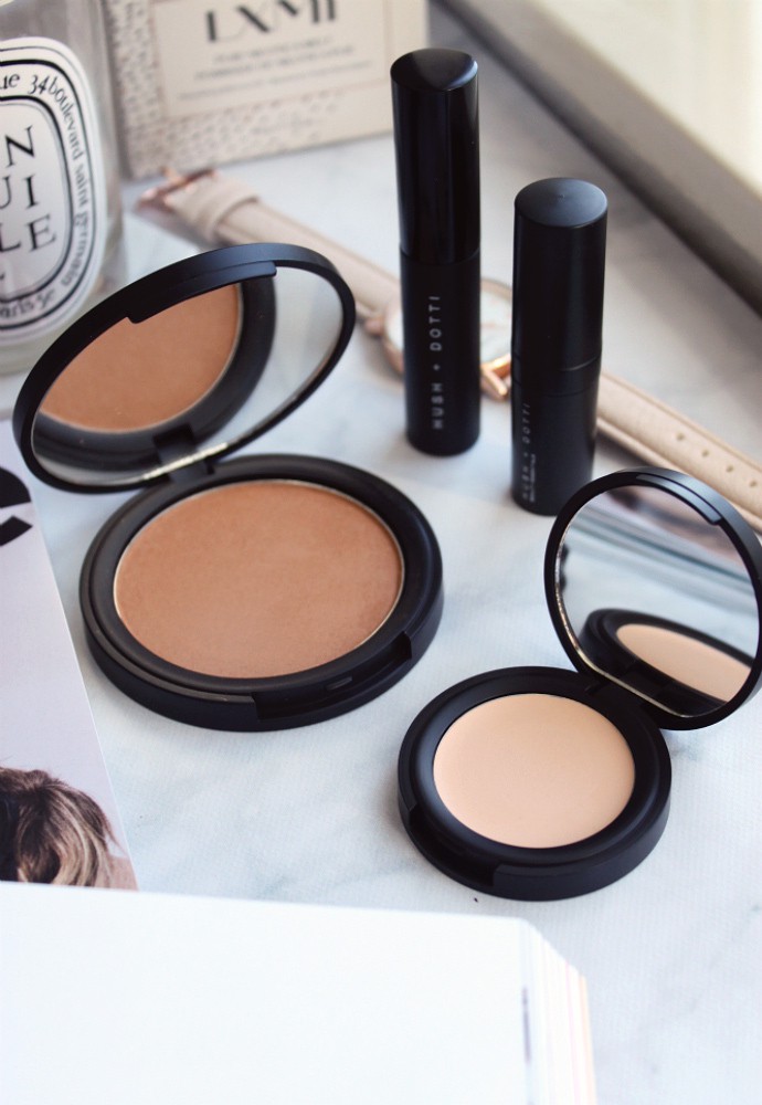 Swatches Clean, Non-Toxic Makeup from Hush + Dotti, Pressed Mineral Foundation in Beach Girl, Organic Concealer in Jane, Organic Mascara, Organic Lipstick in T-Bone